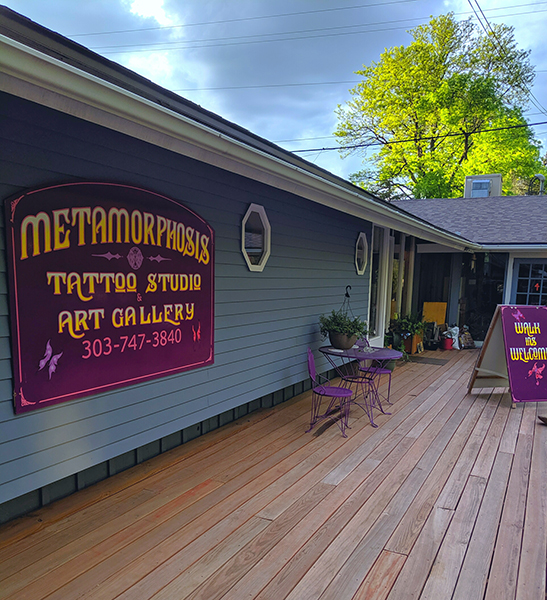 A photo of the exterior of the Metamorphosis Tattoo Studio.
