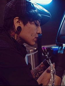 A photo of tattoo artist Dolores.