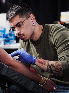 A photo of tattoo artist Ramon Castro.