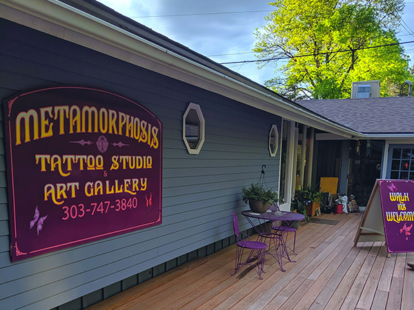 A photo of the exterior of the Metamorphosis Tattoo Studio.